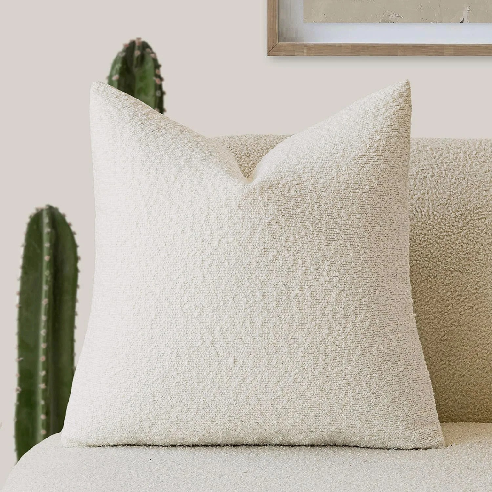 Boucle cushion cover in off white on a chair