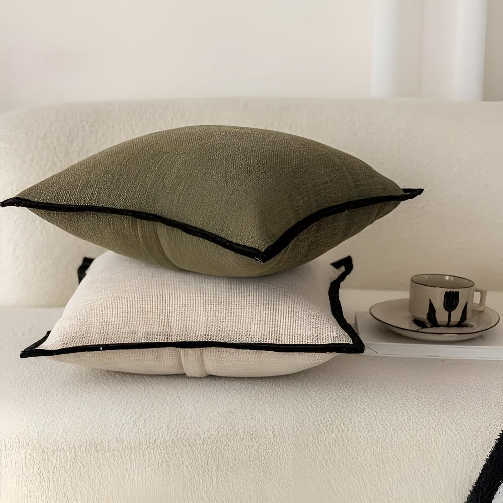 Cushion cover in oatmeal with a black border