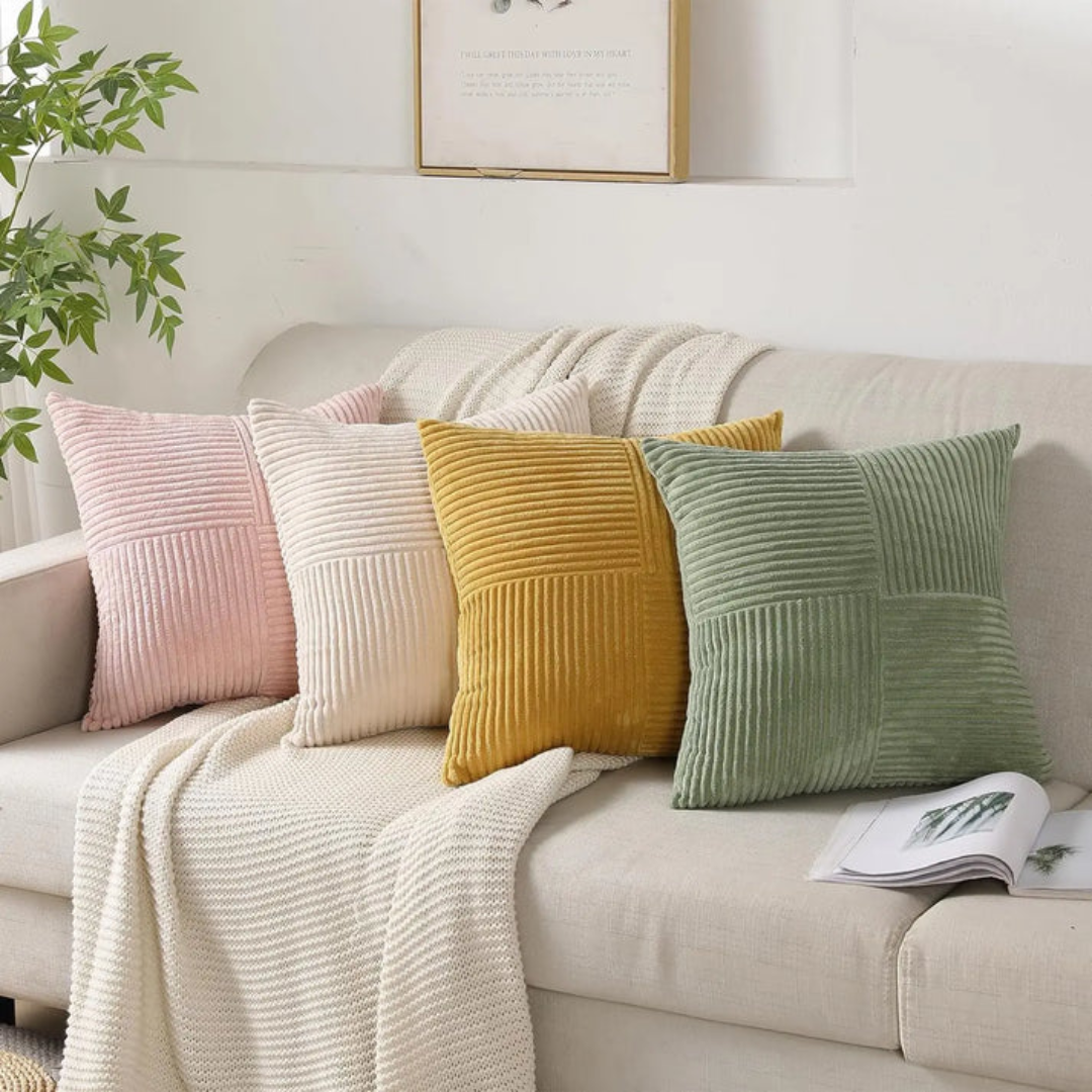 Ribbed corduroy cushion cover in light green on a sofa