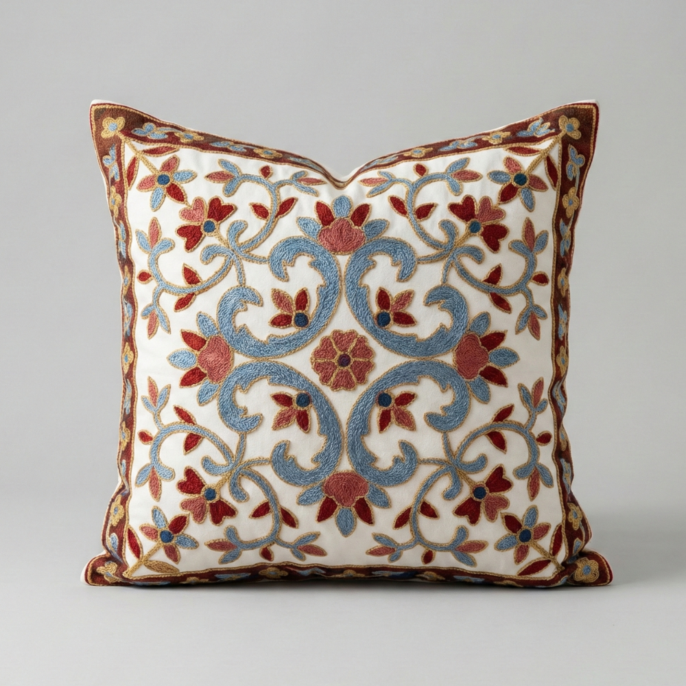 Embroidered cushion in crimson